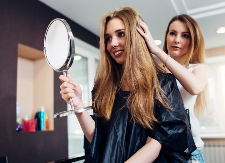 Young woman with a new long hairstyle